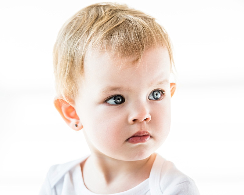 Close up of baby with blue eyes